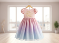 Pink and blue gradient dress with text on a hanger in a bright room.